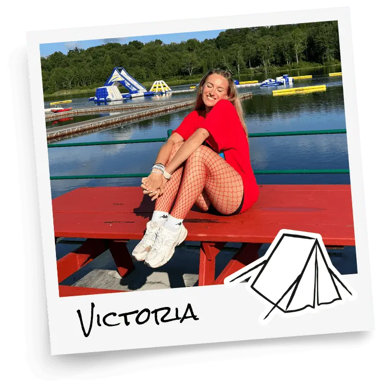 Polaroid of BUNAC creator Victoria sat on bench at summer camp in the US