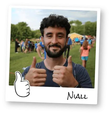 Author Niall poses at summer camp with his thumbs up